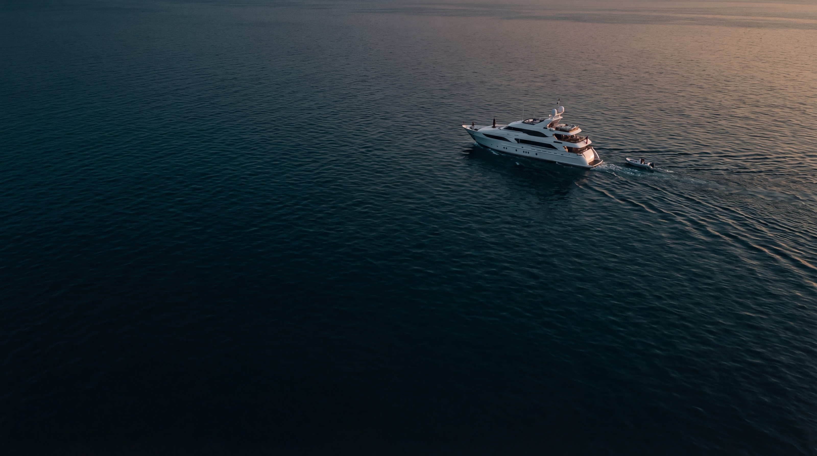 Aerial view of dark ocean water at dusk